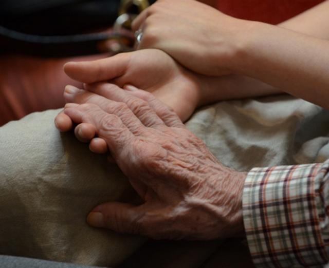 Close up image of two holding hands