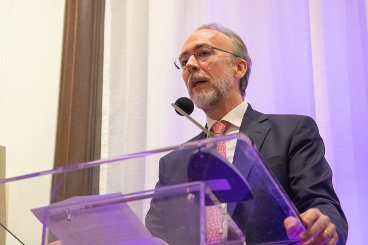 Photograph of a person speaking at a podium