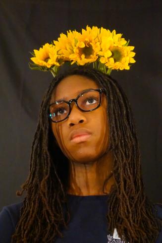 Photograph of student with their flower bouquet 