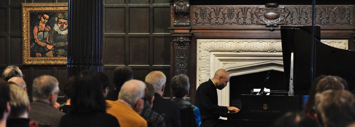 Aaron Diehl performing on the piano in the Music Room