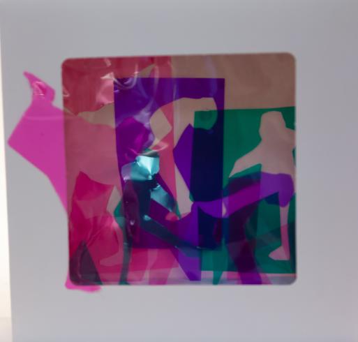 fluorescent light box with neon figurine cutouts  