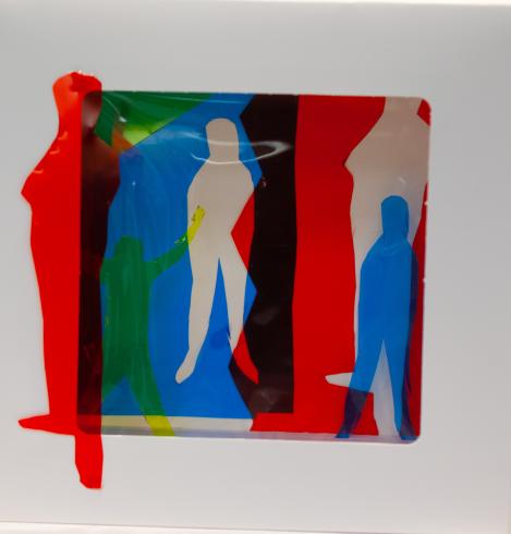 fluorescent light box with neon figurine cutouts  