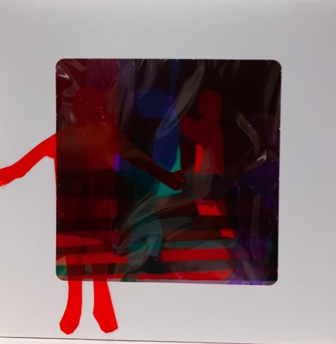 fluorescent light box with neon figurine cutouts  