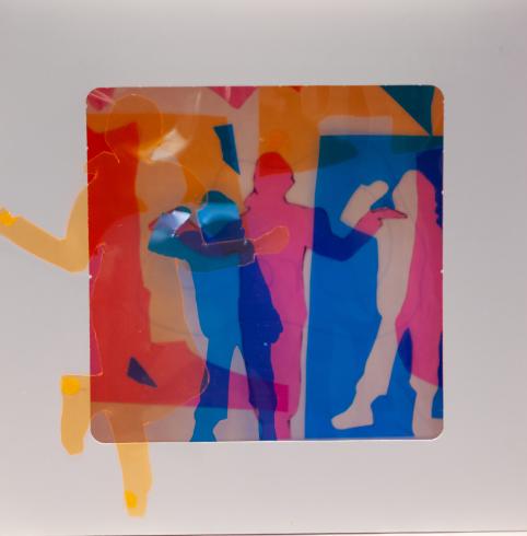 fluorescent light box with neon figurine cutouts  