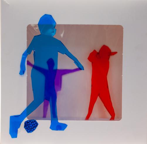 fluorescent light box with neon figurine cutouts  