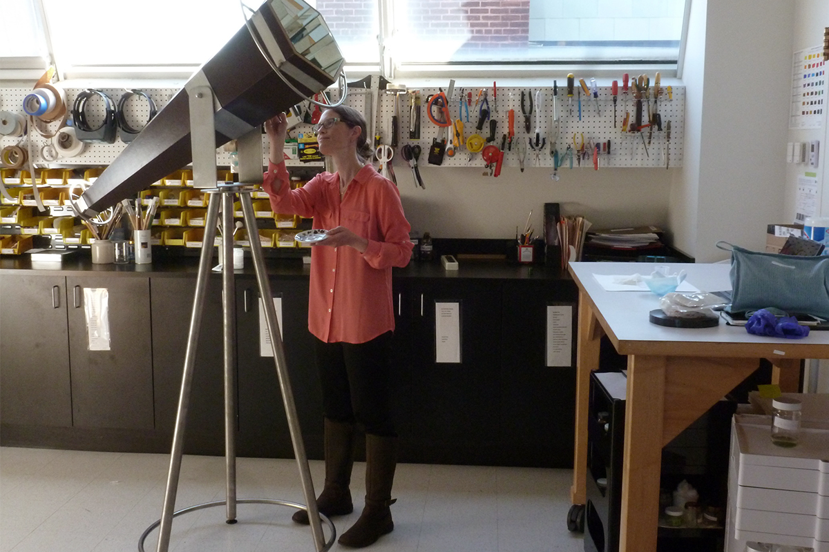 Conservator works in the conservation studio