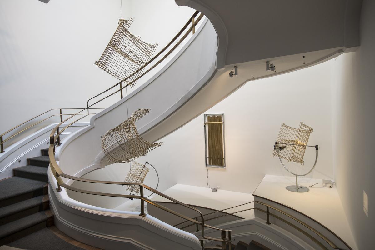 Installation photo of Marley Dawson's ghosts in the Phillips Goh Annex stairwell