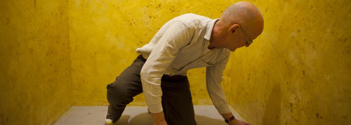 Wolfgang Laib installing the wax room at The Phillips Collection