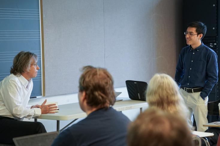 Photograph of musician Anders Hillborg talking to students in a classroom