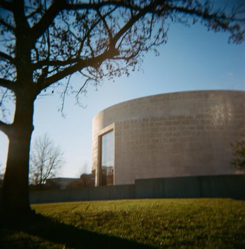 Image of a white geometric building during sunset