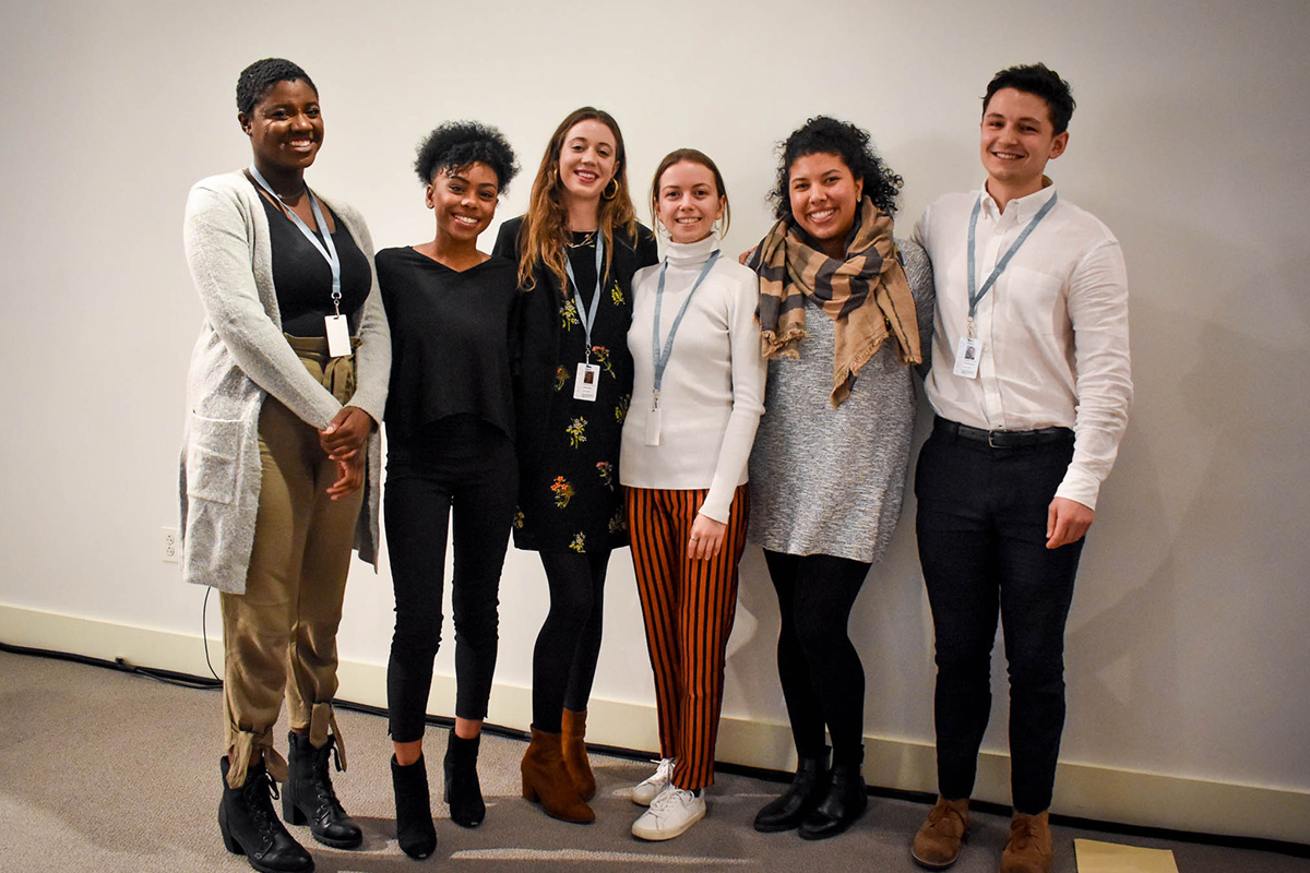 Photograph of a group of six students smiling at the camera