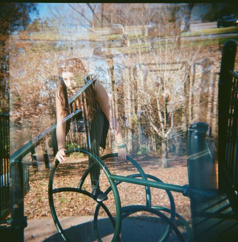 Double exposed image of people playing at a playground 