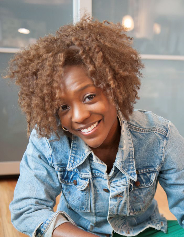 Photo of Nekisha Durrett, a smiling woman wearing a demin jacket